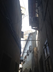 The Catholic cathedral, peaking out from above a Stone Town alleyway.